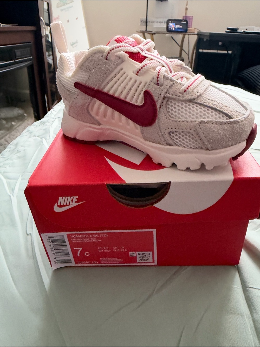 Nike Kids White and Red Athletic Sneakers with Bold Swoosh